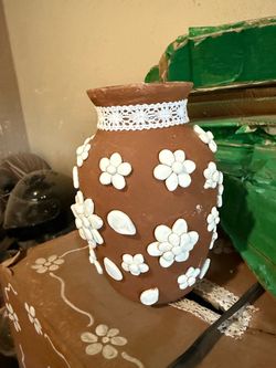 Handcrafted Clay Vase with Raised Flower Design