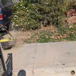 13-In Electric Lawn Mower Ryobi With Grass Catcher Height Adjuster On It