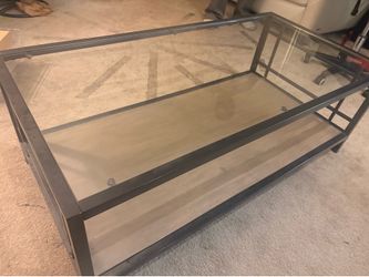 Metal industrial coffee table with glass top
