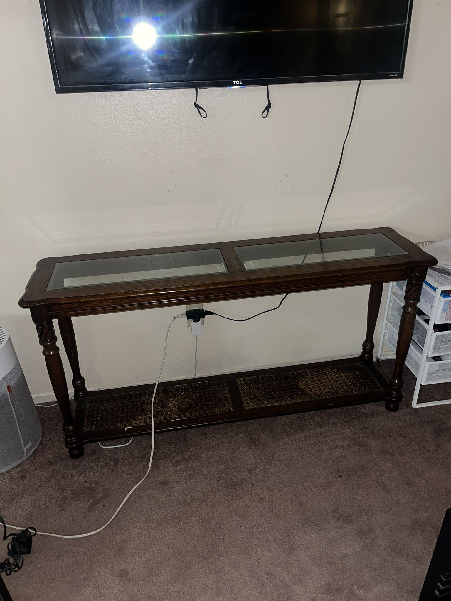 Wooden console table with glass top