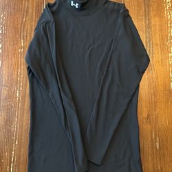 The product is a men's long sleeve compression shirt by Under Armour, featuring HeatGear technology for activewear. The shirt is in size large, with a