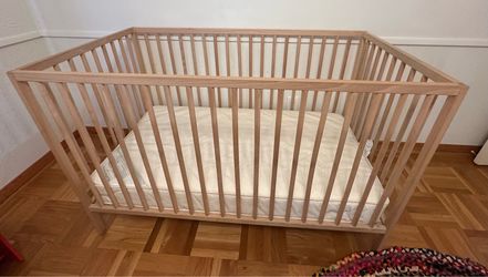 Ikea Sniglar beechwood crib and Naturepedic organic waterproof mattress