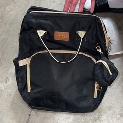 Diaper bag with changing station