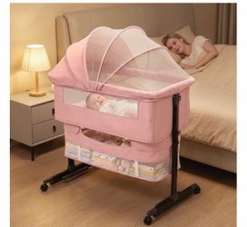 Pink portable baby bassinet