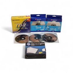 (Lot Of 7) (1)Sony CD-R 10-Pack 700MB (2) Verbatim (3) Singles (1) 50pk Sleeves See Pics. The image displays a collection of blank recordable CDs (CD-
