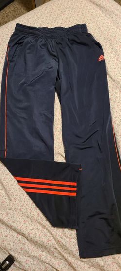 MEDIUM SIZE ADIDAS CLIMALITE NAVY AND ORANGE STRIPED DRAWSTRING SWEAT PANTS