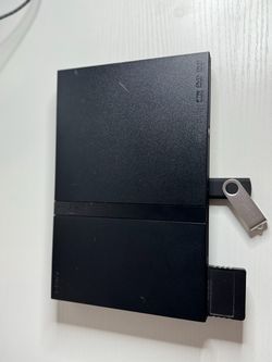 PlayStation 2 Slim –  with PS2 & PS1 Games