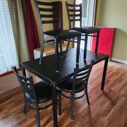 Black Metal Kitchen table with vinyl top with 4 metal chairs with vinyl seats