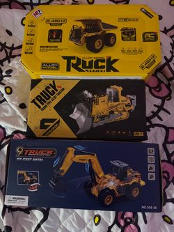 Set of 3 boxed RC construction vehicle toys: a 1:16 scale alloy dump truck with 2.4GHz remote, a track-type alloy bulldozer tractor with 6-channel 2.4