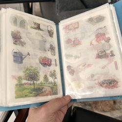 Postcard album with a bunch of Stickers inside