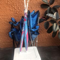 Two  Camp chairs two umbrellas one cooler
