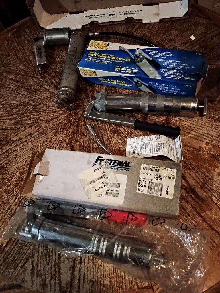 1 Pneumatic Grease Gun & 2 Manual Grease Guns, $25 Each