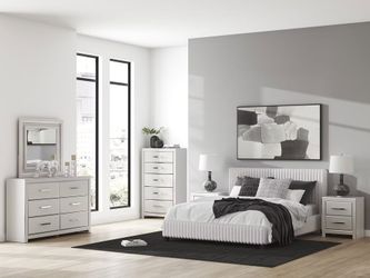 Glam looking bedroom set features corduroy upholstered bed