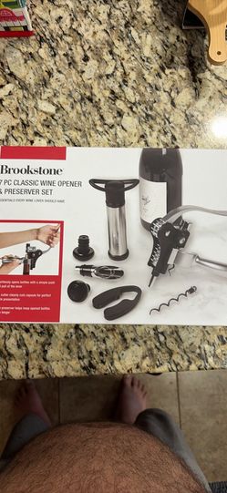 New Brookstone 7 PC Classic Wine Opener & Preserver Set. This set has an air removal pump, an extra teflon coated carbon steel corkscrew, a classic wi
