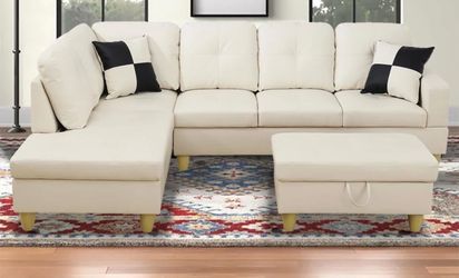White leather sectional couch and ottoman
