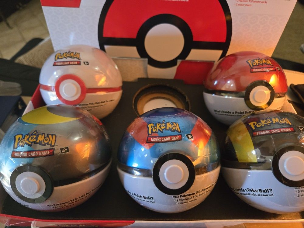 Pokémon Cards And Boosters And Ball Tins