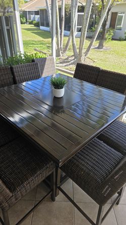 Paradise Trail outdoor bar table with fireplace.