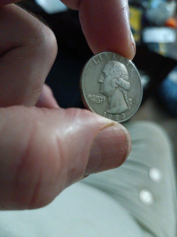 1983 Capital D Quarter Dollar With In In God We Trust Blurred And Blended Together.