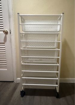 5-tier white metal storage rack with mesh baskets and wheels. 44" ×21"
