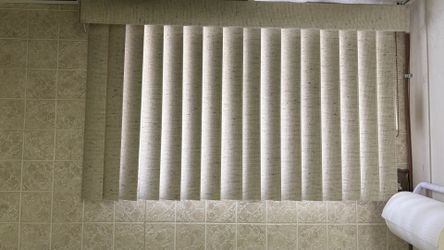 Basement window, vertical blinds excellent condition