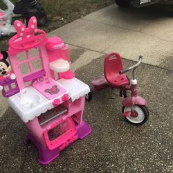 A Disney Character Doll House To Play Pretend.  A Good Tricycle To Learn How To Ride A Bike