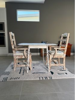 Dining table, two chair, rug