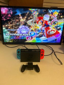 Nintendo Switch HAC-001 console system with cord and base. No games.