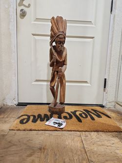 a vintage hand-carved wooden statue 