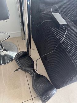 Black electric hoverboard with a charger