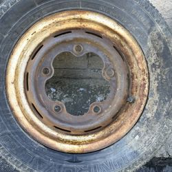 One 15 inch wide 5 Volkswagen steel rim with old tire Beetle bug van 