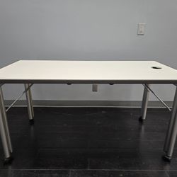 Desk with folding legs and locking wheels 60"x30 " height is 28-1/2"