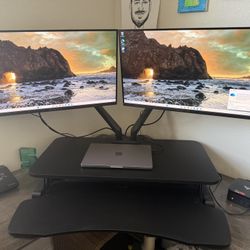 Monitor with arms and standing desk