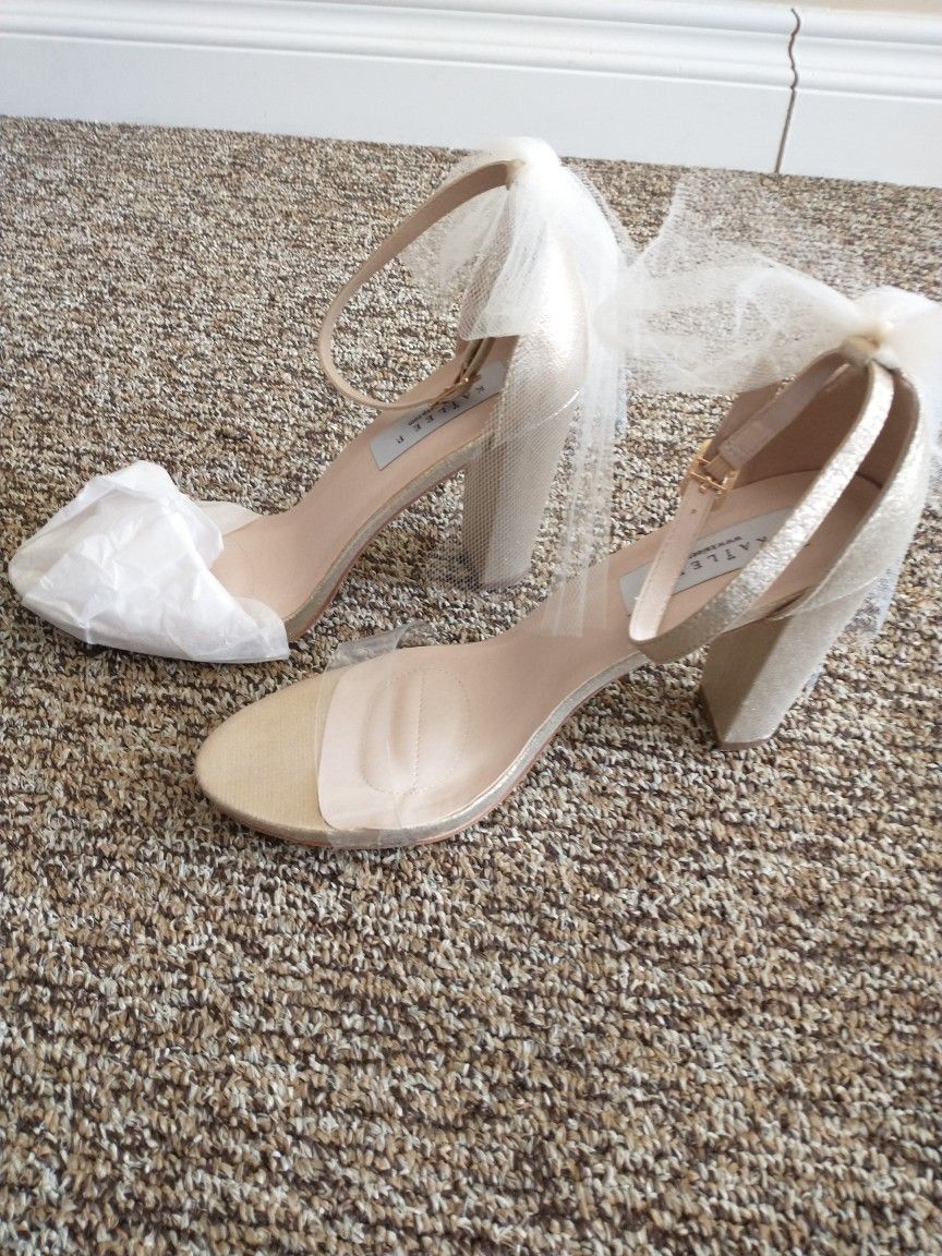 Unworn bridal shoes. Sized 10. Run very small.