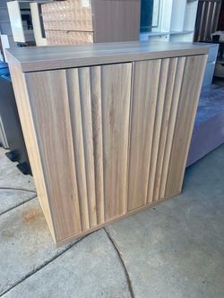 Wood-Tone Storage Cabinet with Fluted Doors