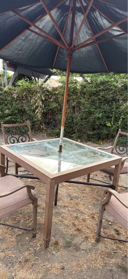 Outdoor table with umbrella