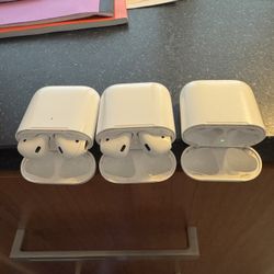 2 Pairs Of AirPods 2nd Gen and 3 Charging Cases (one Supports Wireless)