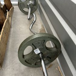 pair of 25lb iron plates 1inch hole with curl bar $60   