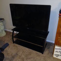 50 Inch Magnavox TV And Three Tier Glass TV Stand