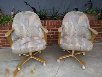 Two identical swivel chairs that roll perfectly