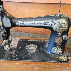 Price negotiable. Antique Singer sewing machine, box mounted storage