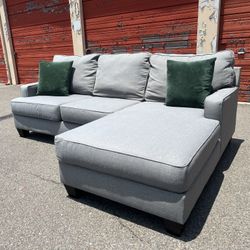 Ashley’s Gray Sectional Sofa Couch with right facing chaise