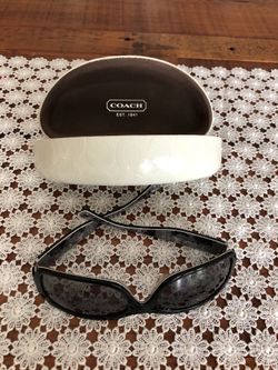 Woman’s Coach sunglasses.