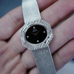 PIAGET WHITE GOLD LARGE DIAGONAL BAGUETTE BEZEL WATCH WITH ONYX DIAL 7334A6