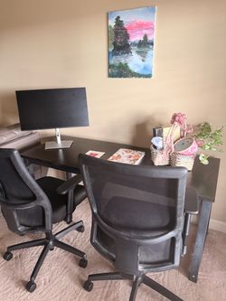 Black L-Shaped Desk with Two Office Chairs