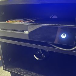 Xbox one + game controller’s and steering wheel with pedals 