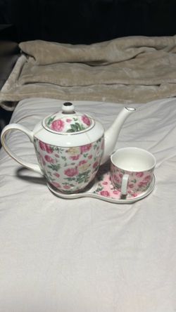 Tea pot and cup