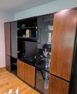 large, brown& black wooden entertainment center ( 112" L × 78" H × 21"D)