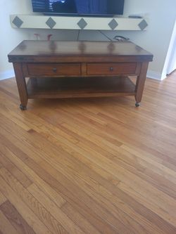 Wood Coffee Table with Drawers and Casters
