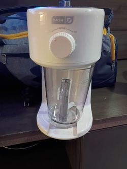 This white Dash Deluxe Shaved Ice & Slushy Maker features a dial for adjusting ice texture between coarse, medium, and https://offerup.com/redirect/?o