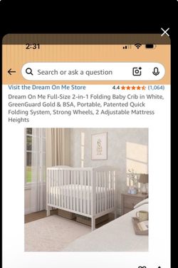 White crib folds up for storage